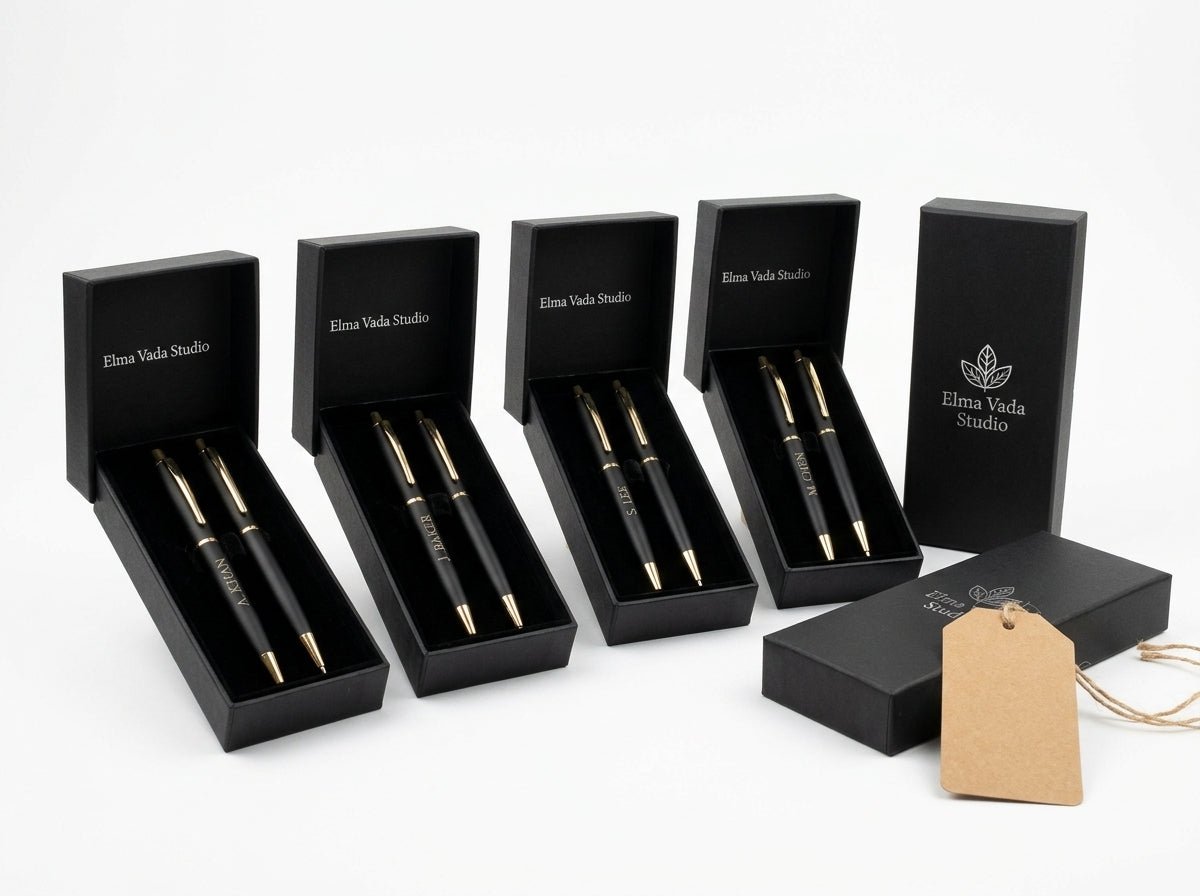 Four black pen sets with individual engraved names in presentation boxes. Dallas