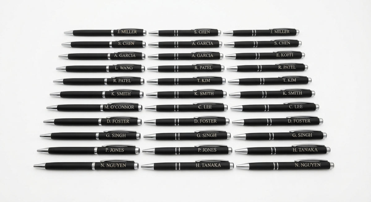 Row of black pens with individual engraved names. Elma Vada Studio. Dallas