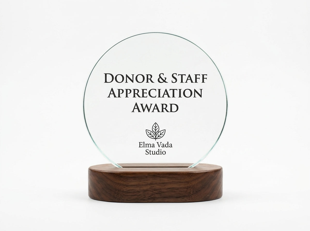 Clear circular recognition award mounted on a wooden base with personalized donor appreciation text.