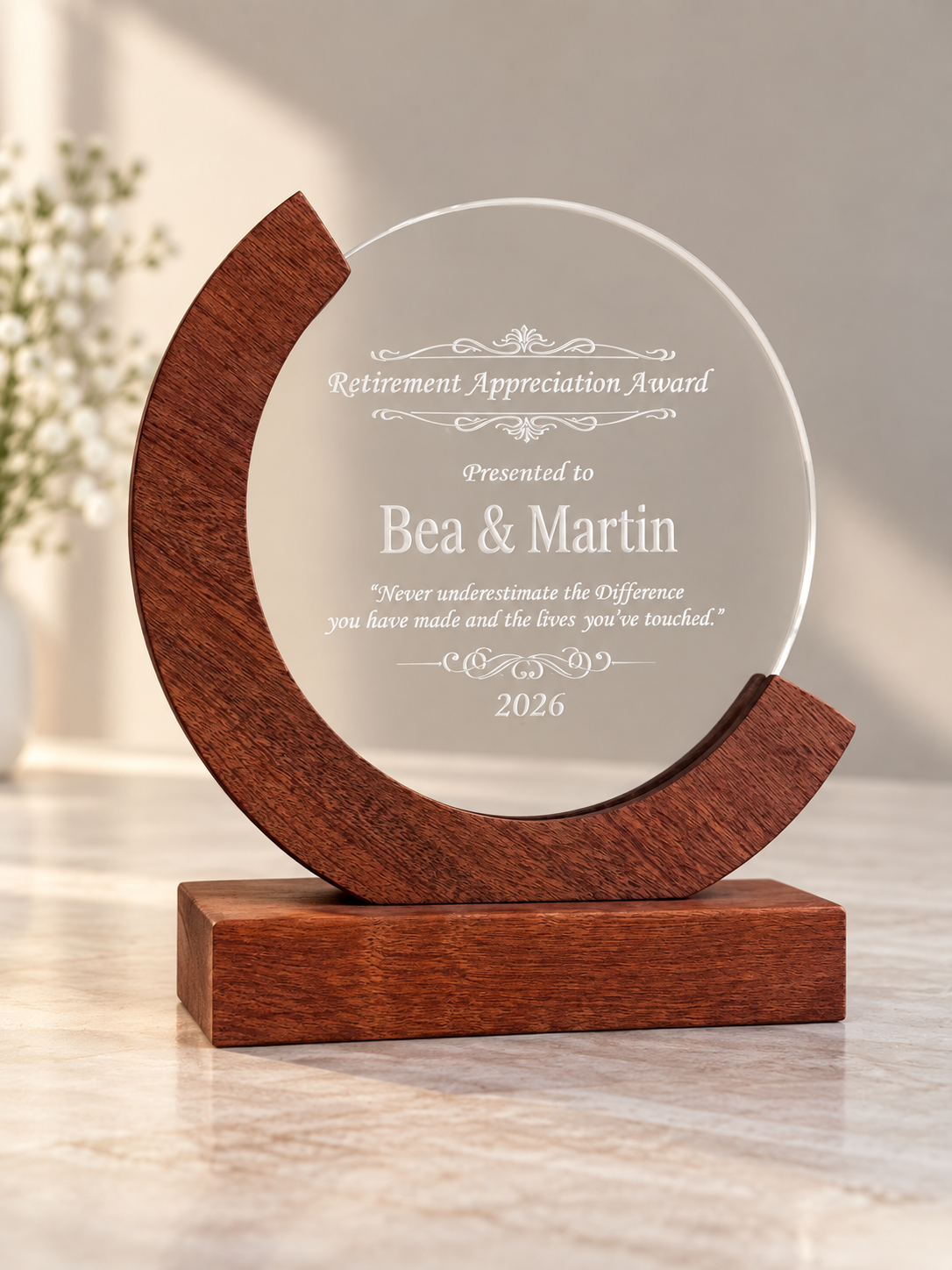 Clear recognition award mounted on a curved wooden base.