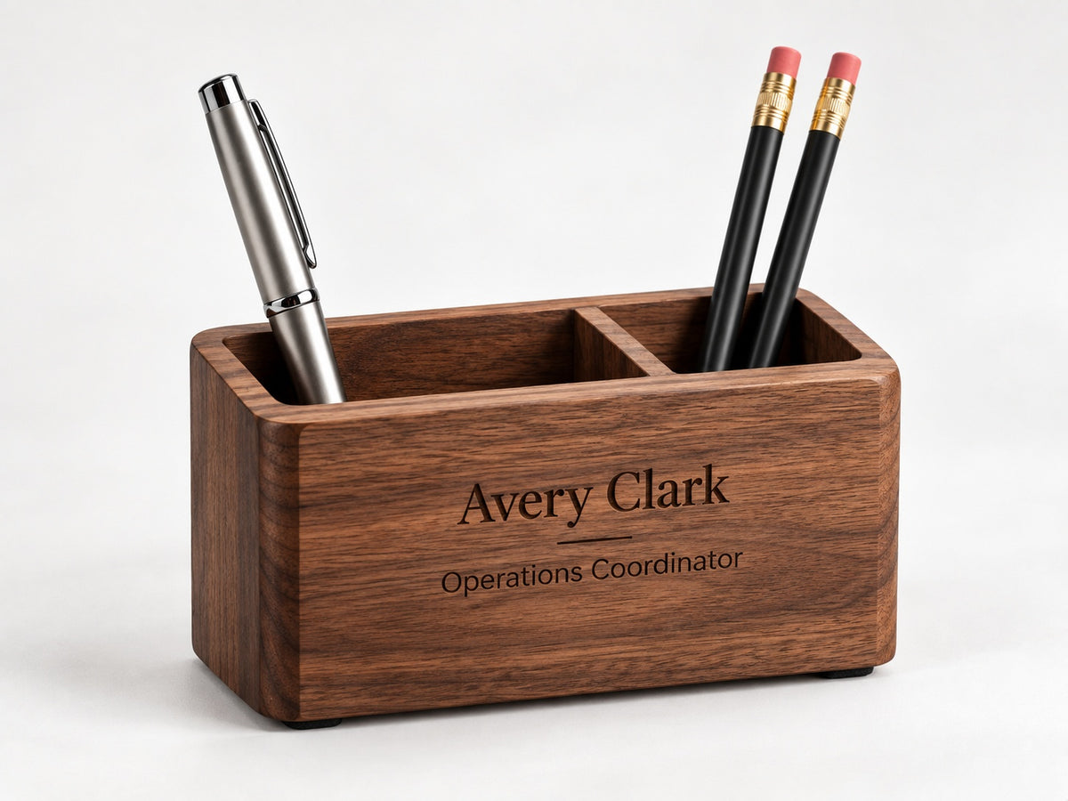 Personalized wooden desk organizer engraved with an employee name and job title, shown with a pen and pencils.